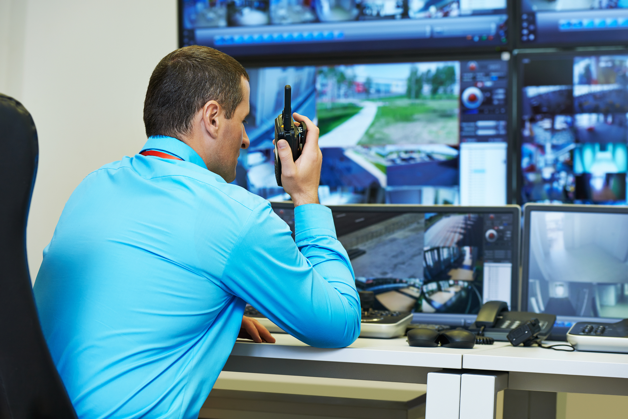 security guard watching video monitoring surveillance security s