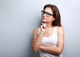 Thinking Serious Young Woman In Glasses Looking On Empty Copy Sp